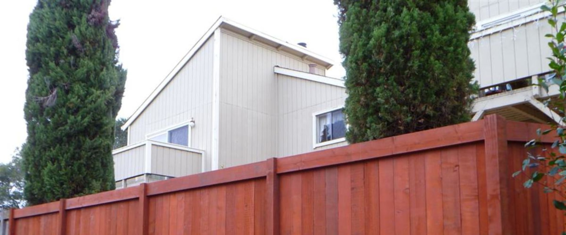 Applying Stain to a Fence
